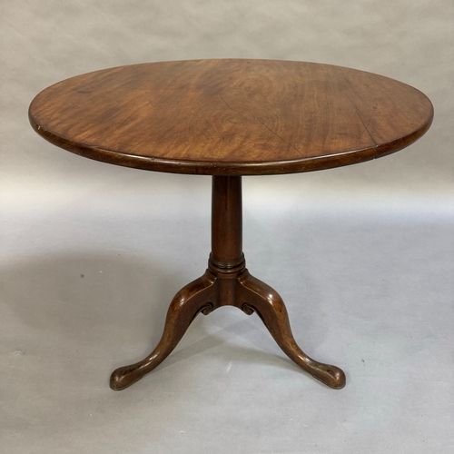 306 - A mahogany Georgian tilt top table (at fault), tripod base with pad feet, 80cm wide, 73cm high