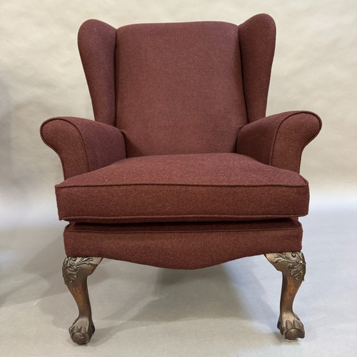 348 - A pair of 1960's wing back armchairs upholstered in aubergine fabric, cabriole claw and ball feet, s... 