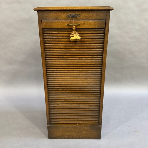 308 - A 1920's oak tambour fronted filing cabinet with nine trays, 48cm wide, 103cm high, 42cm deep