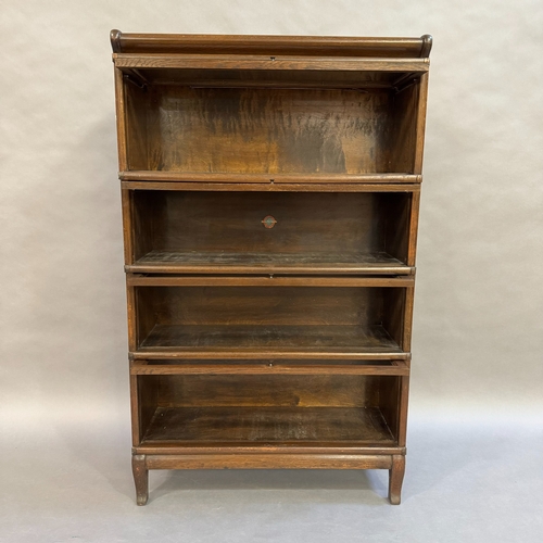 309 - An oak 1930's Globe Wernicke stacking bookcase, four height with glazed doors, 87cm wide, 142cm high... 