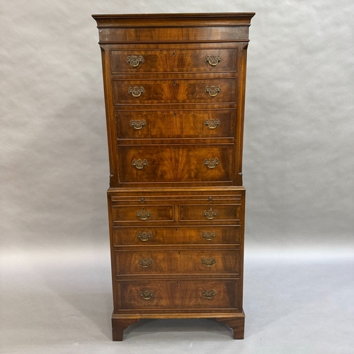 312 - A mahogany reproduction chest on chest, four height above pull out slide, the lower section having t... 