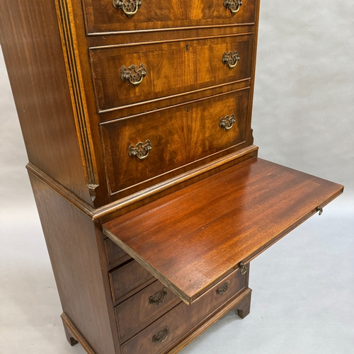 312 - A mahogany reproduction chest on chest, four height above pull out slide, the lower section having t... 