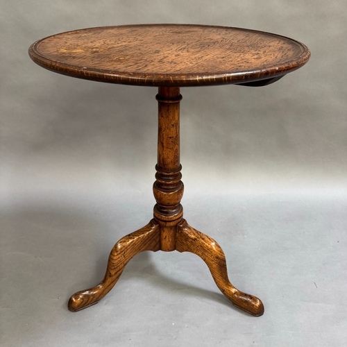 358 - An oak reproduction tripod table, turned column on tripod base, 56cm diameter, 69cm high