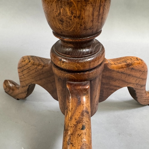 358 - An oak reproduction tripod table, turned column on tripod base, 56cm diameter, 69cm high