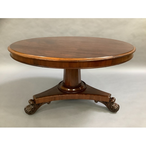 317 - An Early Victorian Figured Mahogany centre table, the top with moulded lip above a shallow frieze, o... 