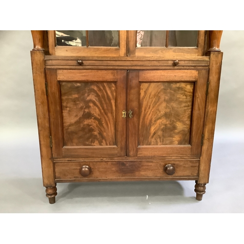 307 - A mahogany reproduction glazed bookcase above two door cupboard, single slide and single drawer, tur... 