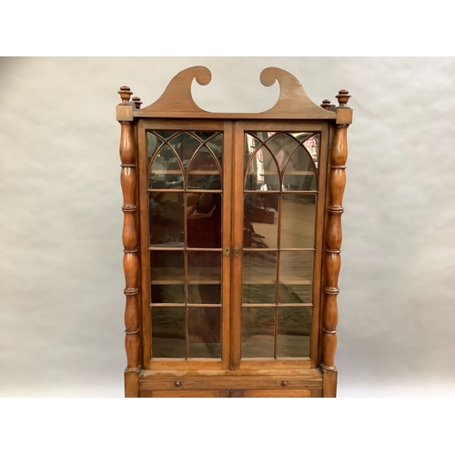 307 - A mahogany reproduction glazed bookcase above two door cupboard, single slide and single drawer, tur... 