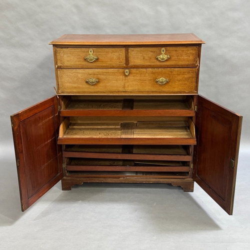 328 - A Victorian mahogany cupboard with satinwood inlay,, two short drawers above one long drawer, the lo... 