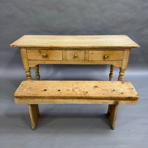 114 - A Victorian stripped pine kitchen side table, one short central drawers flanked by two longer drawer... 