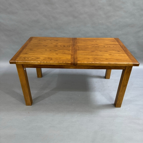 350 - A modern oak pull out dining table with hidden leaf, on square detachable legs, closed 150cm x 90cm