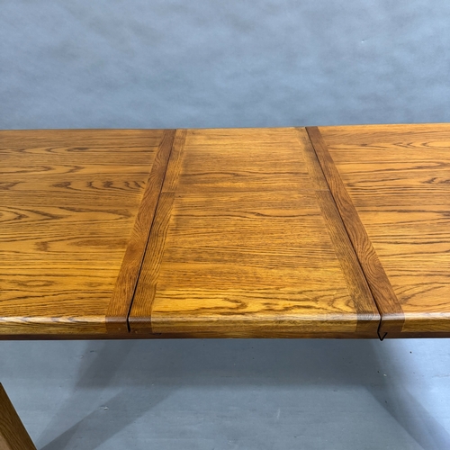 350 - A modern oak pull out dining table with hidden leaf, on square detachable legs, closed 150cm x 90cm