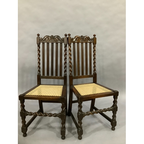 102 - A pair of oak high back dining chairs with barley twist supports and cane seating