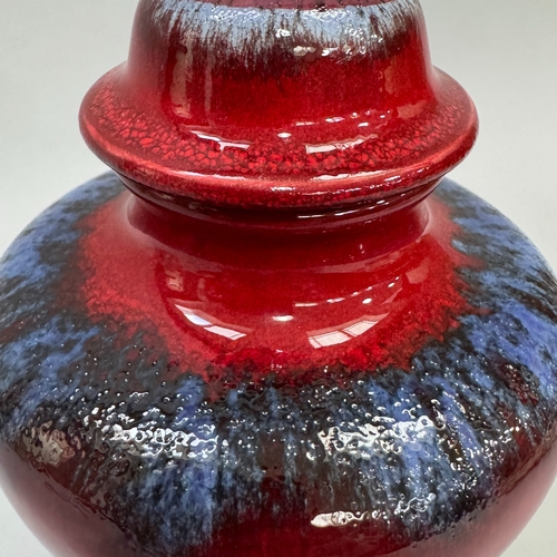 15 - A Poole Pottery 'Ruskin' vase designed by Karen R Ford, oxford red and blue enamelled with domed cov... 