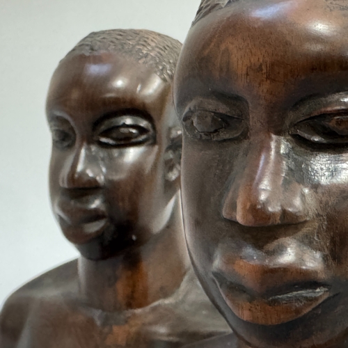 21 - A pair of African hardwood carved head and shoulder busts of male and female, 17.5cm and 17cm high