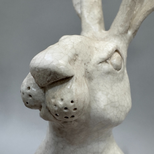 40 - A studio pottery sculpture of a hare by Alison Coaton, in off-white crackle glaze finish, 34cm high