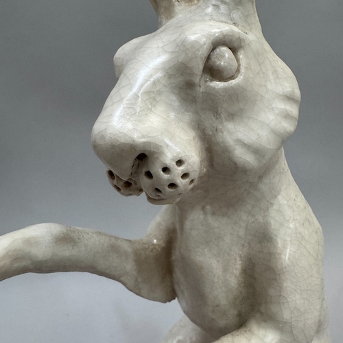 43 - A studio pottery sculpture of a hare by Alison Coaton, in off-white crackle glaze, artist's mark to ... 