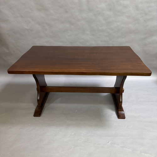 351 - A dark stained dining table on twin refectory supports, 153cm long, 91cm wide