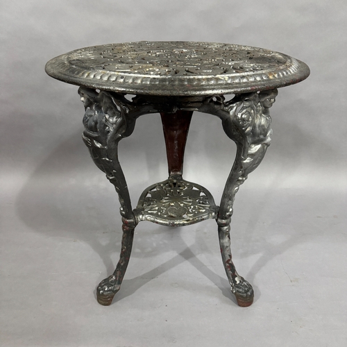 319 - A cast iron pub table, tripod base with under tier, 60cm diameter, 66cm high