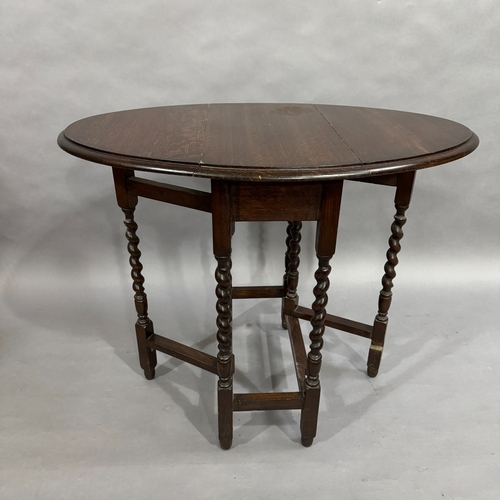 321 - A 1930's oak barley twist gate leg table, 60cm x 90cm when fully opened