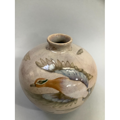 14 - A Cobridge stoneware vase, ovoid, painted with ducks in flight, on a tinted pale salmon ground, impr... 