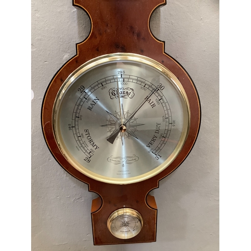 49 - A yew wood aneroid barometer by Committi, with hygrometer, 68cm long (as new, in original packaging)