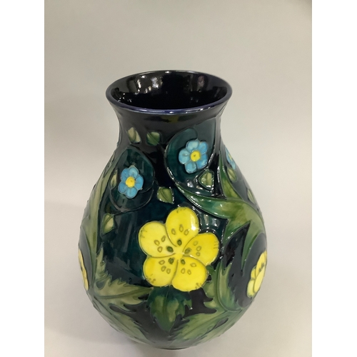 5 - A Moorcroft Buttercup pattern vase, tubelined and enamelled in shades of blue, green and yellow, ovo... 