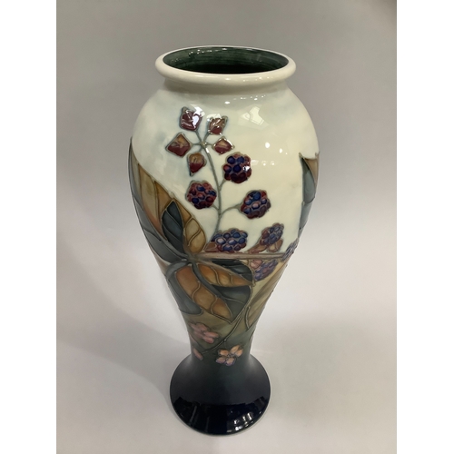 7 - A Moorcroft Bramble pattern vase, tubelined and enamelled in shades of brown, mauve and blue against... 