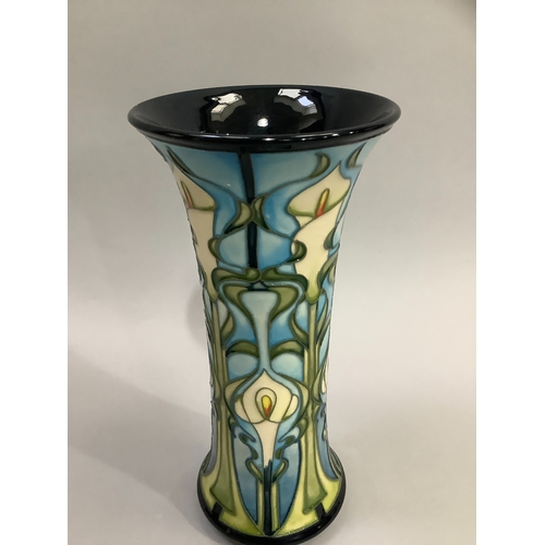 9 - A Moorcroft Calla Lily pattern vase, tubelined and enamelled in shades of blue, green and ivory, imp... 