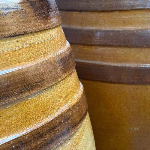 28 - A pair of large 19th century Doulton stoneware salt glaze spirit barrels of oval outline, 45cm high