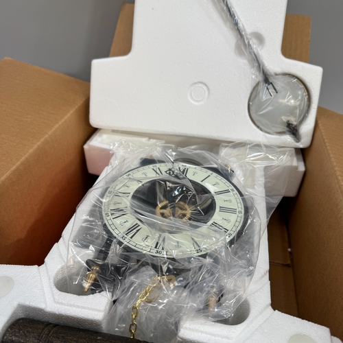 47 - A Hermle wall clock with skeleton movement, pendulum and weights (as new, in original packing, RRP £... 