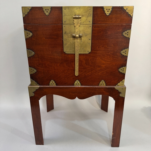 329 - A Chinese mahogany and brass mounted box on stand, 43cm wide max x 33cm deep max x 65cm high