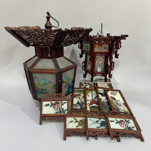 52 - Two 20th century Chinese hardwood lanterns with reverse painted glass panels, the largest 38cm diame... 