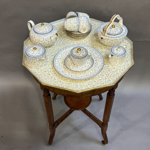 64 - A early 20th century Wedgwood bone china tea service and matching tray top table, the eleven sided c... 