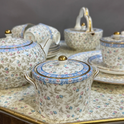 64 - A early 20th century Wedgwood bone china tea service and matching tray top table, the eleven sided c... 