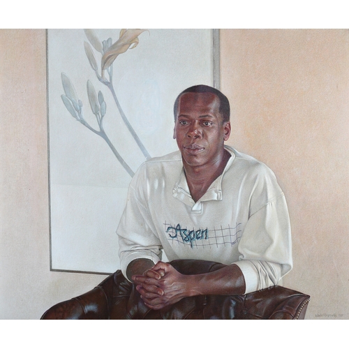 13 - Wade Reynolds (American 1929-2001), portrait of a young black man, wearing a white sweatshirt with A... 