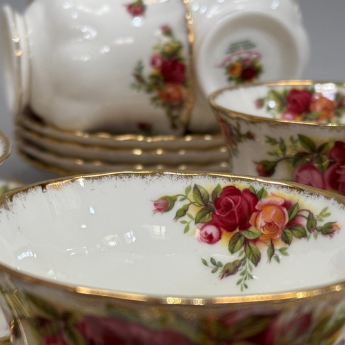 74 - An Royal Albert Old Country Roses tea service comprising teapot, sugar and cream, seven teacups and ... 