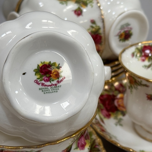 74 - An Royal Albert Old Country Roses tea service comprising teapot, sugar and cream, seven teacups and ... 