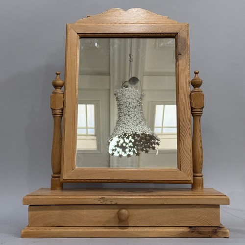 103 - A pine toilet mirror with rectangular glass with drawer to base, 44.5cm wide, 56cm high