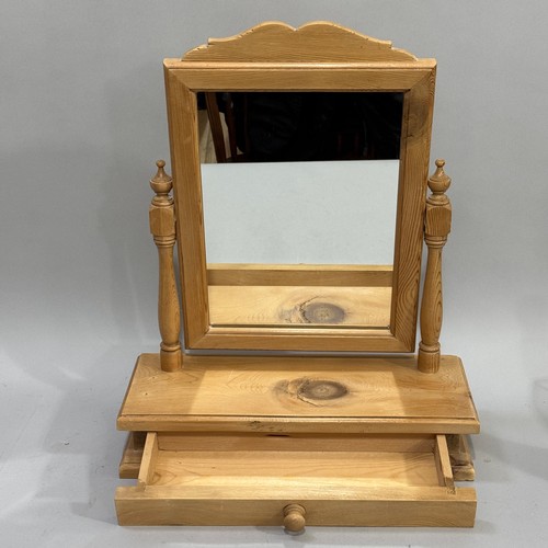 103 - A pine toilet mirror with rectangular glass with drawer to base, 44.5cm wide, 56cm high