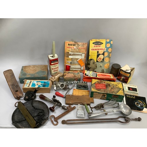 97 - A collection of vintage kitchenalia, some in original packaging including a pastry press, bean slice... 