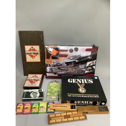 92 - A box of games including dominoes, cribbage, card games, Picture This, Monopoly, Genius, Fast and Fu... 