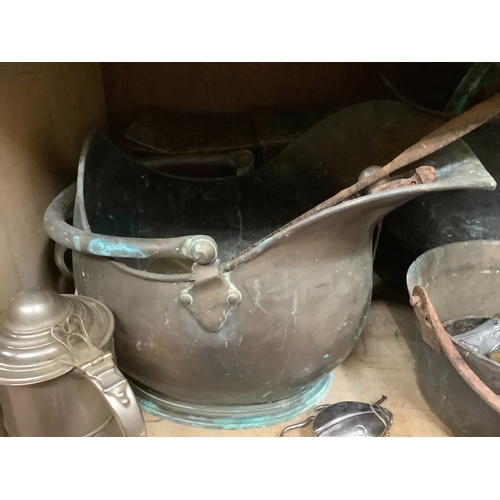 100 - A large collection of brass and copper items to include jam pans, trivets, coal helmets, candlestick... 