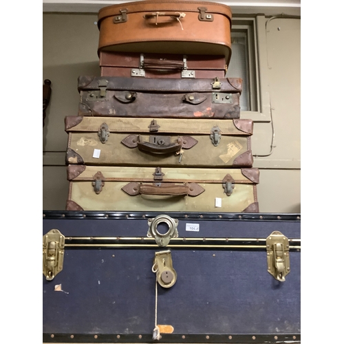 104 - Six various vintage suitcases together with a collection of wallets, purses and a handbag