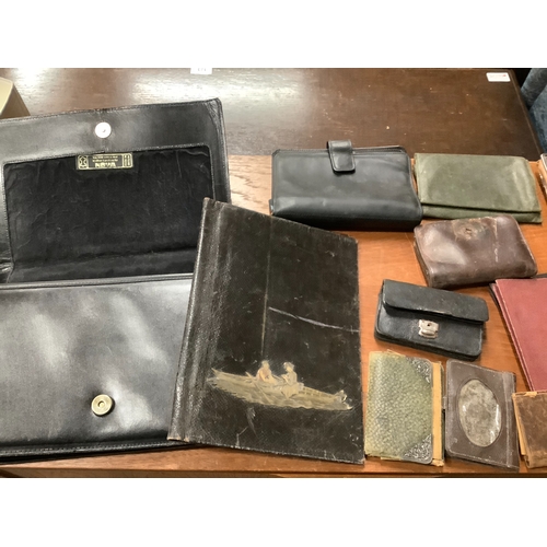 104 - Six various vintage suitcases together with a collection of wallets, purses and a handbag