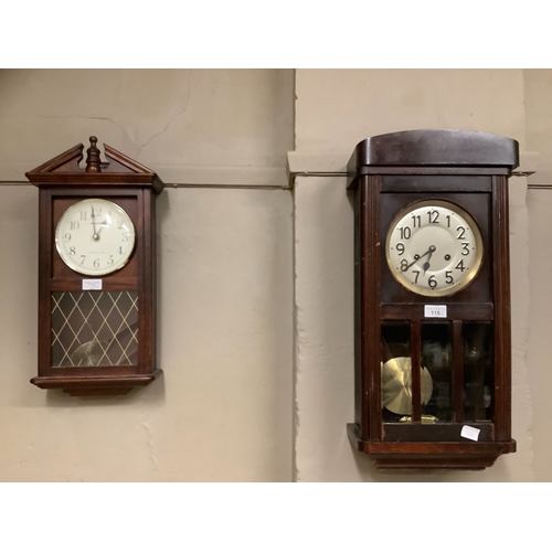 115 - A 1940s wall clock together with a further reproduction wall clock