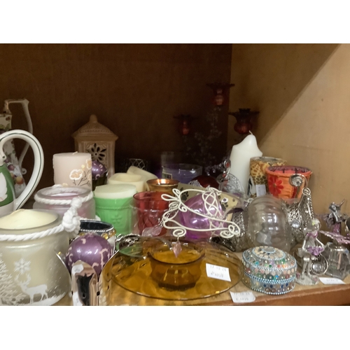 95 - A small collection of candle related items to include floral decorated candelabra, tealight holders,... 