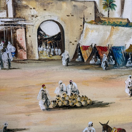 310 - Late 20th century Arab market scene, Libya, oil on canvas, signed N. Hsniefr 99', 75cm x 109cm