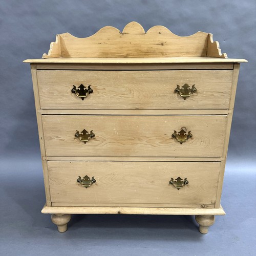 112 - A pine three height chest of drawers, galleried top, brass drop handles, on turned legs, 89cm wide, ... 