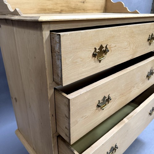 112 - A pine three height chest of drawers, galleried top, brass drop handles, on turned legs, 89cm wide, ... 