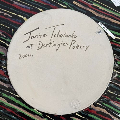 63 - Janice Tchalenko (1942-2018) for Dartington Pottery, a large circular charger glazed with stripes in... 